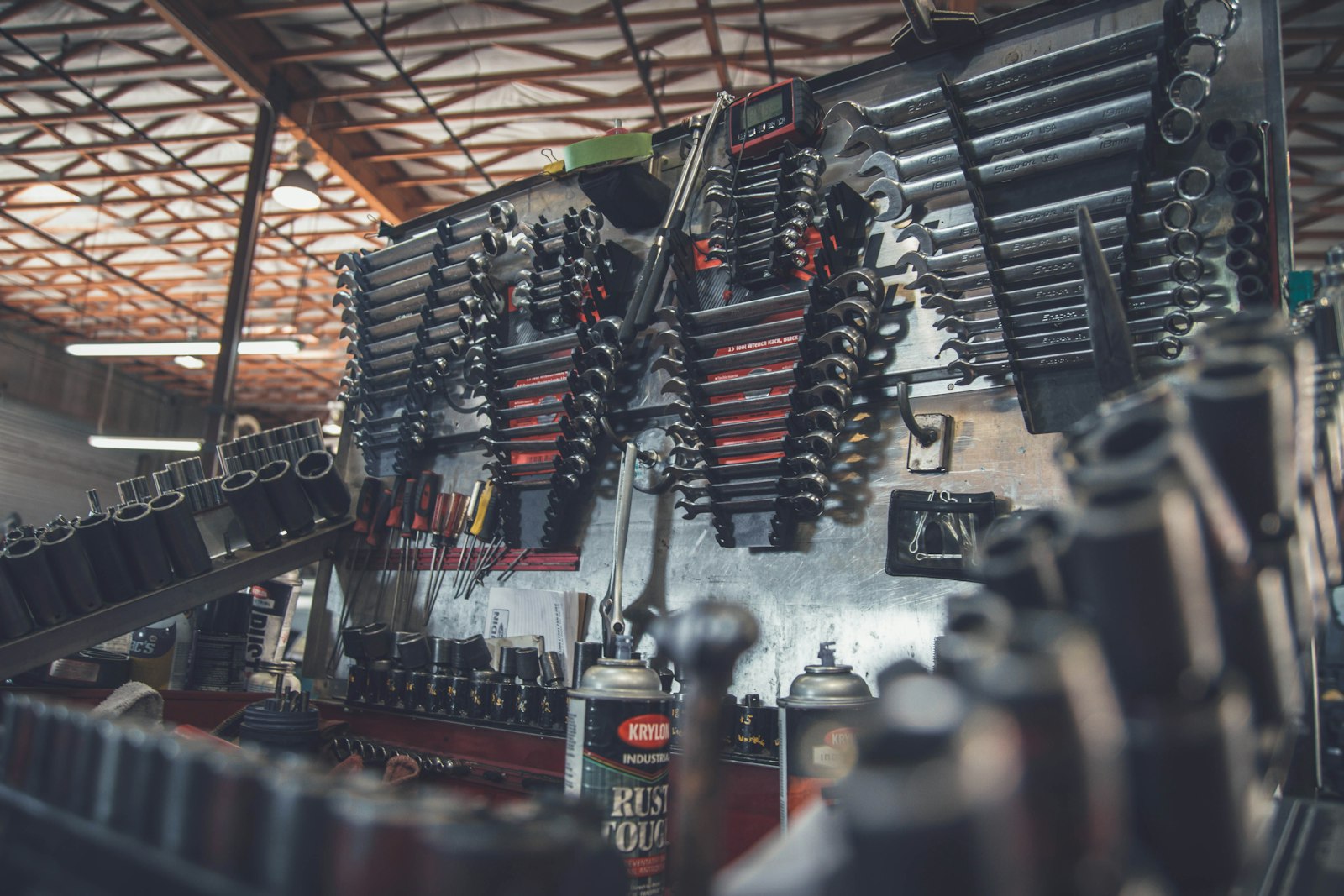 Professional ASE certified auto repair mechanic working on car engine